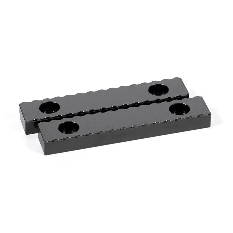 A black serrated gripper made of hardened steel, designed for tool clamping in machining applications.